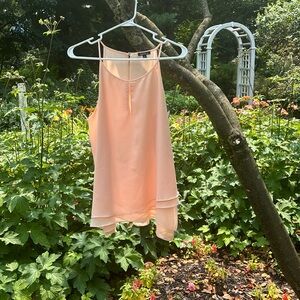 Beautifully tiered top, spaghetti straps, keyhole opening in front.Pale peach